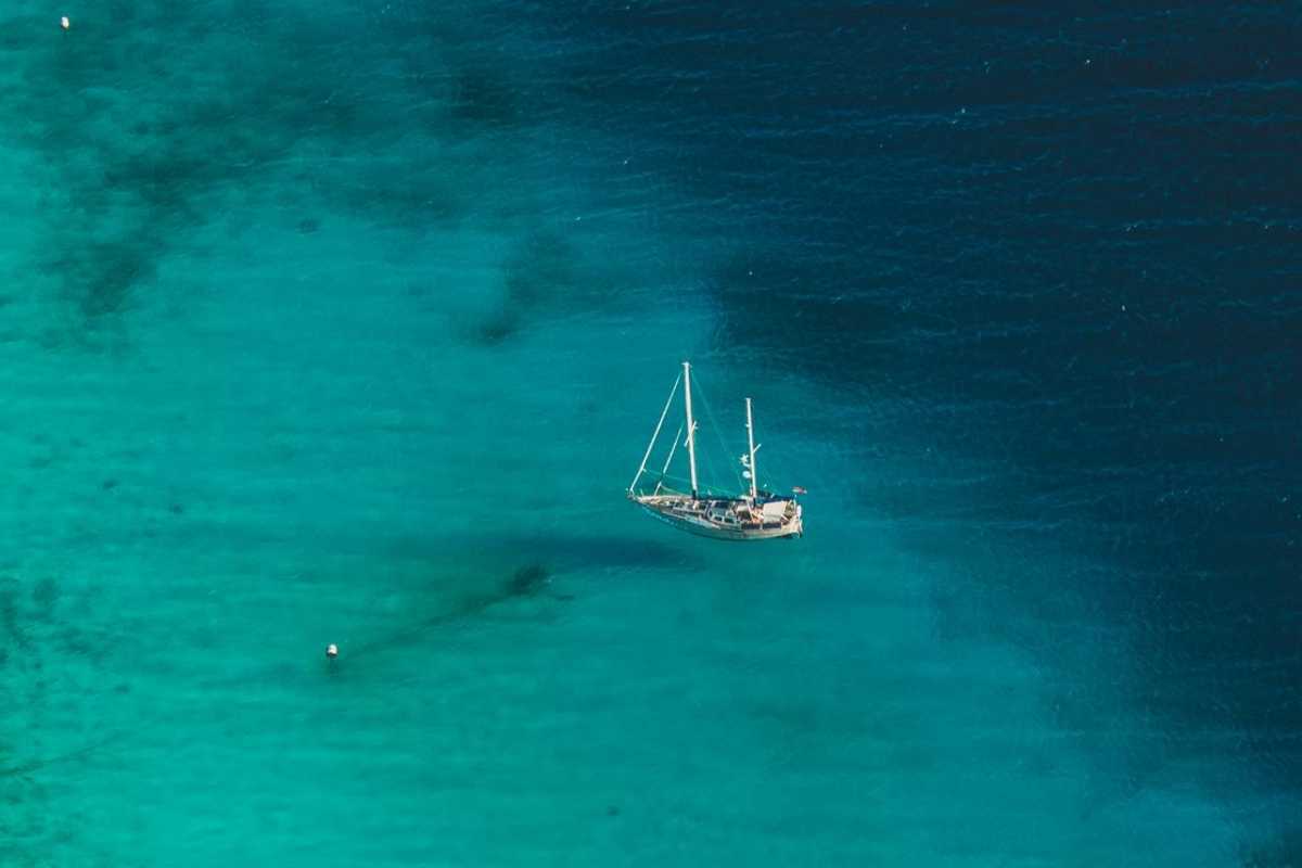 a boat on a deep blue sea